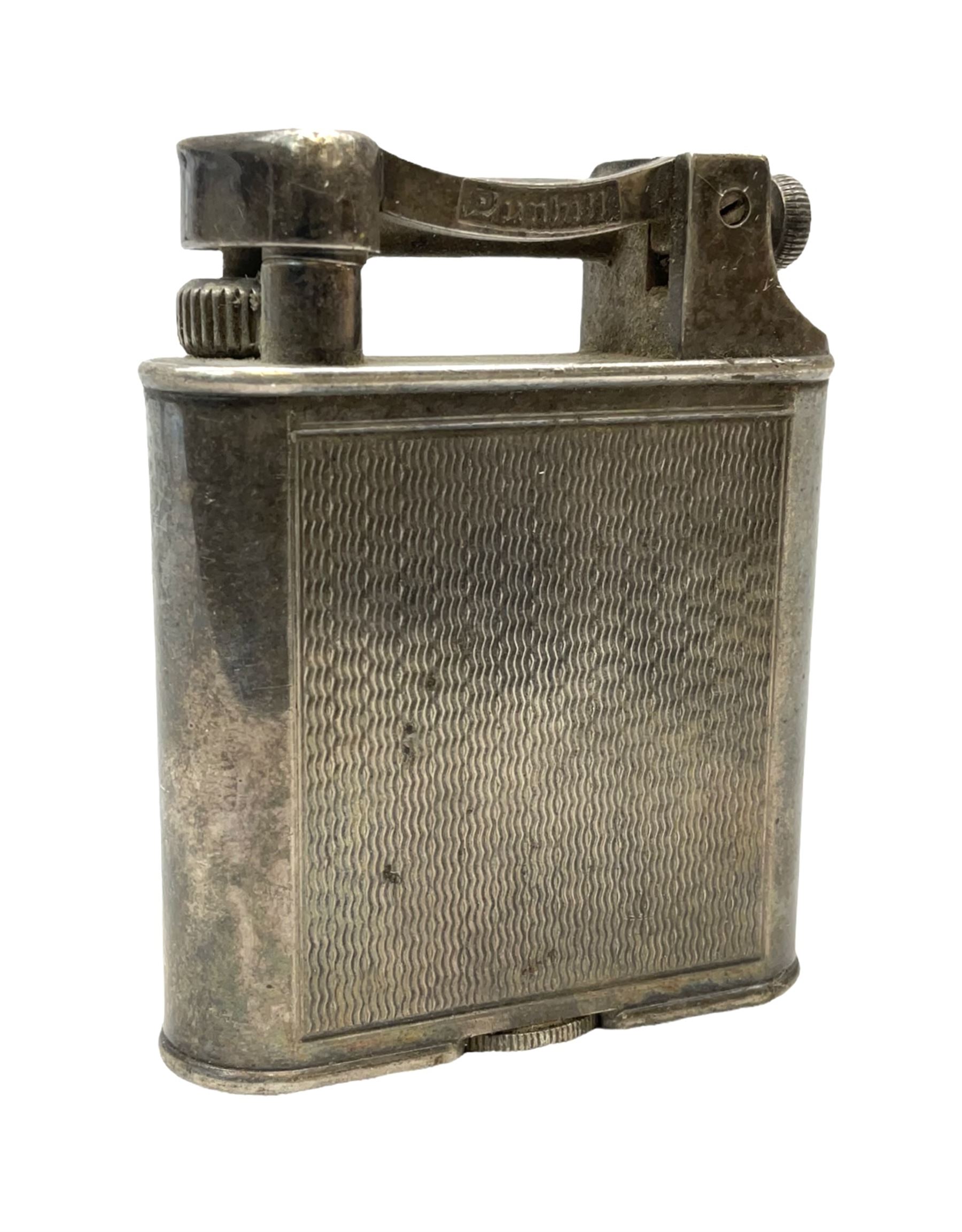 Dunhill silver plated lift-arm lighter, of rectangular form with engine turned decoration, signed Dunhill, base impressed Pat. No. 390107, H5cm