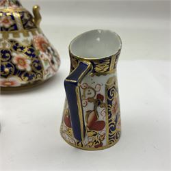 Pair of Royal Crown Derby 6299 imari pattern miniature vases, together with a miniature pitcher and dish in 2451 imari pattern, all with printed marks beneath, vase H12cm 