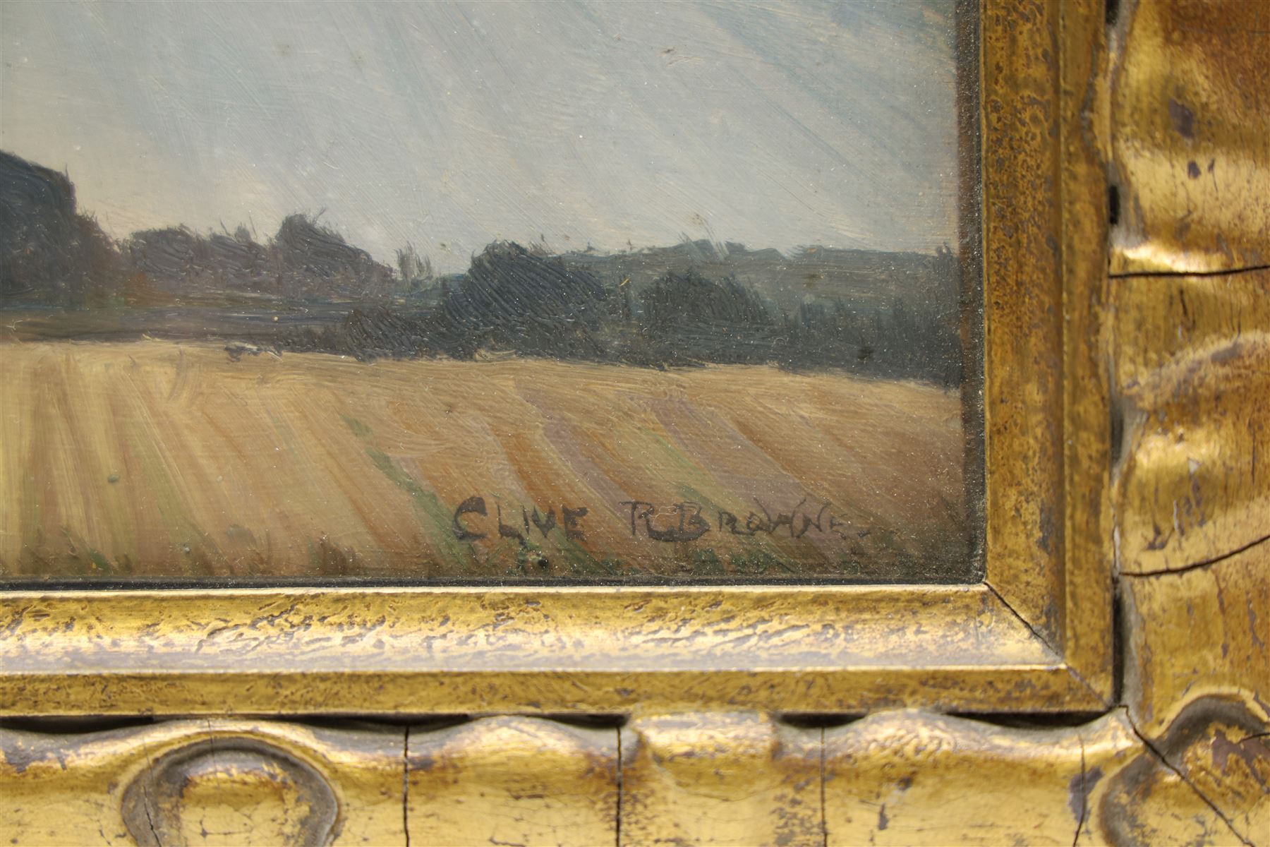 Clive Richard Browne (British 1901-1991): Open Fields Landscape, oil on board signed 21cm x 26cm; Joan Newton (British 19th/20th century): 'The Two Churches - Alvingham' Lincolnshire, oil on canvas signed, titled on label verso 30.5cm x 40.5cm (2) (one unframed)