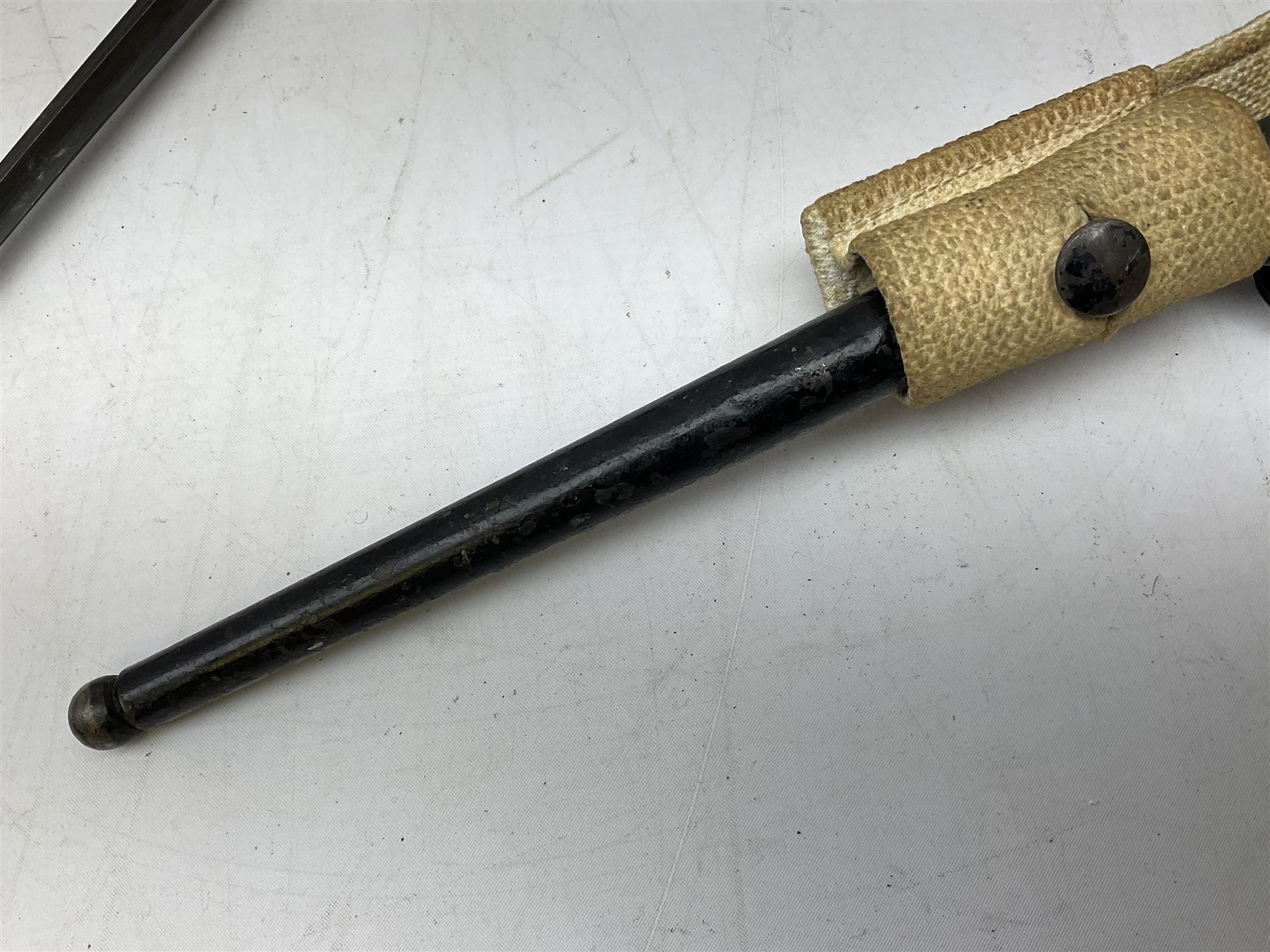 British Pattern 1876 socket bayonet with 43cm steel triangular blade L52cm overall; another socket bayonet with cruciform blade; No.4 Mk.II spike bayonet in metal scabbard with webbing frog; and 1955 Army jack knife by J.H. Thompson Sheffield (4)