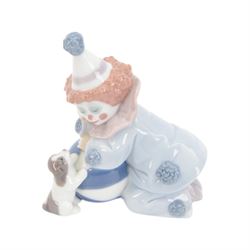 Four Lladro clown figures, comprising Having a Ball 5813, Little Clown 5811, Clown with Puppy 5278 and Pierrot with Concertina 5279