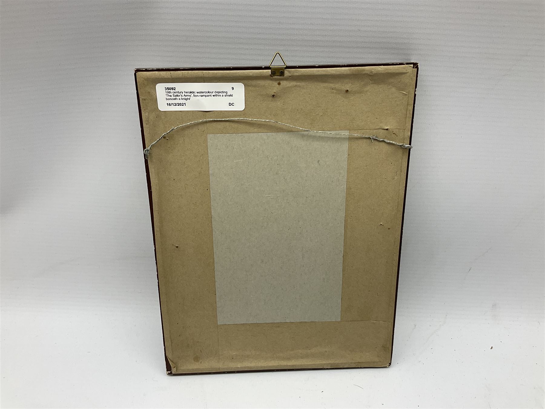 19th century heraldic watercolour depicting 'The Salor's Arms', lion rampant within a shield beneath a knight's helmet, embellished with floral and scrolling decoration, inscribed with family motto 'Fortis et Fidelis' (Strong and Faithful) 