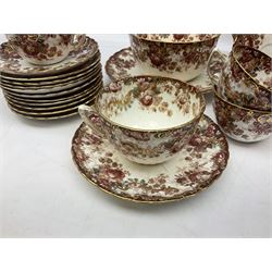 Victorian tea service for twelve decorated with floral and gilt design borders upon plain ground with scalloped edge comprising twelve teacups and saucers, twelve plates, milk jug and bowl, two sandwich plates and further coffee cup, saucer and plate, with impressed and printed marks beneath