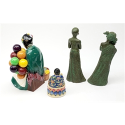A Royal Doulton figurine, The Old Balloon Seller HN1315, together with a small figure of a seated buddha, marked beneath Japan, and a pair of bronzed composite male and female figures, H20cm. 