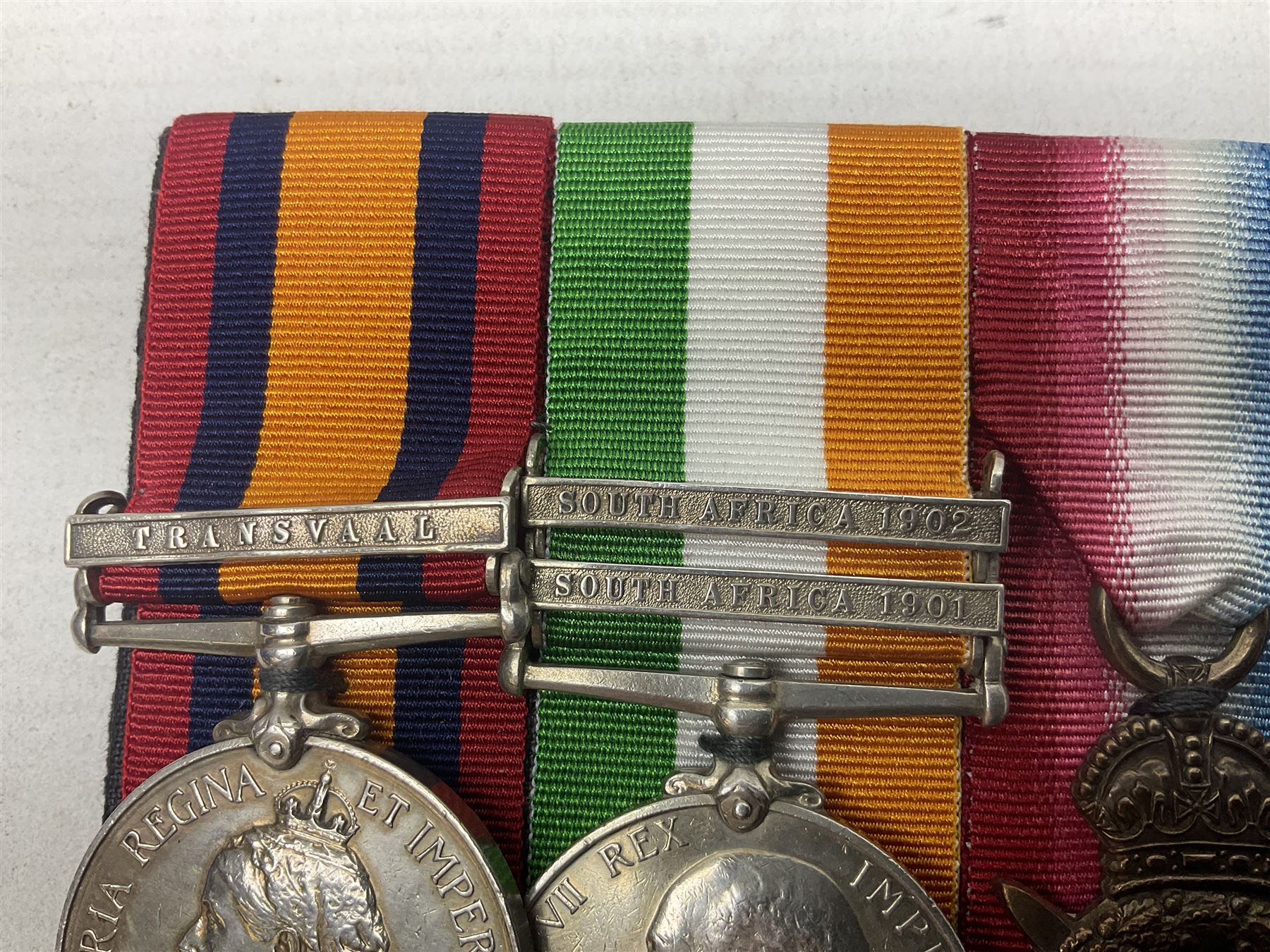 Boer War/WW1 group of five medals comprising Queens South Africa Medal with Transvaal clasp and Kings South Africa Medal with two clasps for South Africa 1901 & 1902 awarded to  2269 Pte. G. Thompson K.R.R.C.; together with British War Medal, 1914 Star and Victory Medal awarded to 6683 Pte. G.H. Thompson 3-HRS.; all with ribbons mounted for display on card; together with copy death certificate following discharge due to being physically unfit and other biographical photocopies.