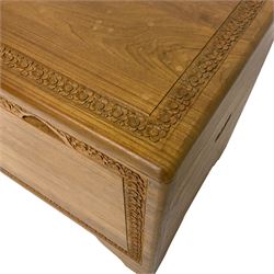 Mid-to-late 20th century Singapore camphor wood blanket chest, the hinged lid and front decorated with flower head carved bands