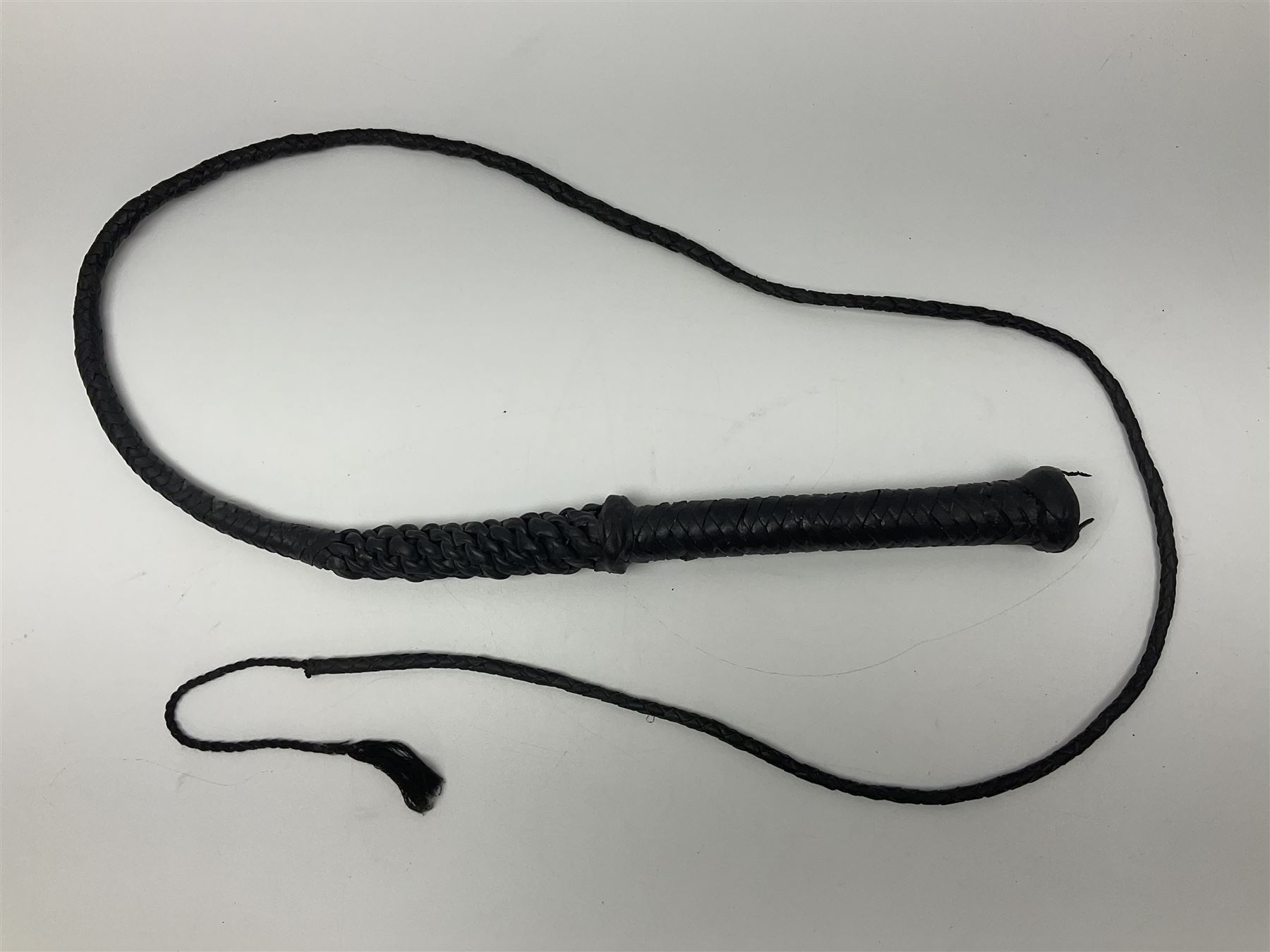 Near pair of short swords each with slightly curving 41cm fullered steel blade and all brass H-shaped hilt L52cm overall; plaited black leather whip; and reproduction pair of brass hilted swords, brass halberd blade and mace (7)