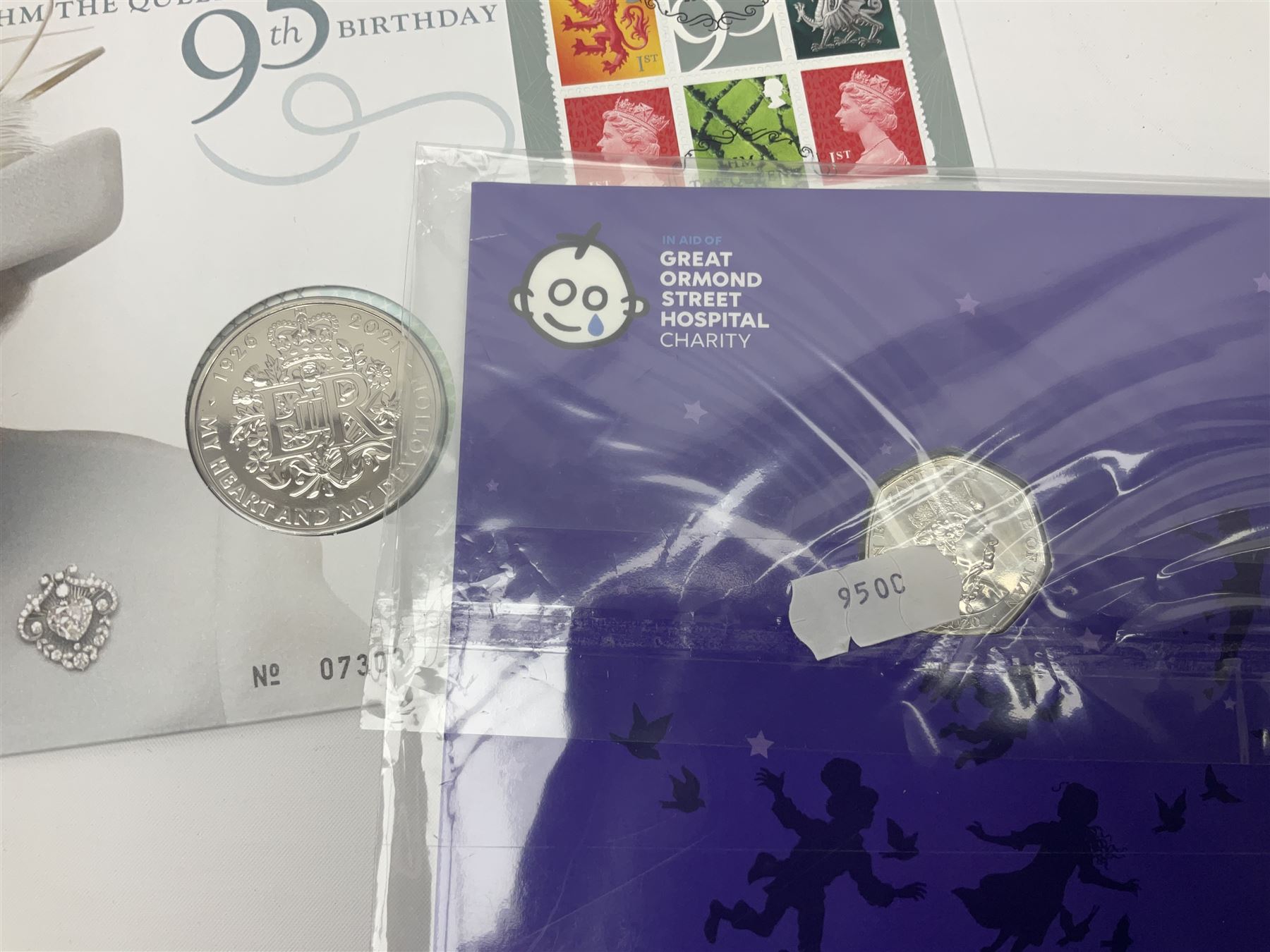 Commemorative coins and covers, including '80th Anniversary of the Battle of Britain' coin cover with Solomon Islands 2020 half dollar, 'Royal National Lifeboat Institution' coin cover with Alderney 2021 five pounds, 'Queen Elizabeth II's 95th Birthday' coin cover with Solomon Islands 2021 half dollar, other similar coin covers all in Harrington and Byrne folders, The Royal Mail 'HM The Queen's 95th Birthday' coin cover with 2021 five pounds and Queen Elizabeth II Isle of Man 2020 'Peter Pan' fifty pence coin collection in card folder