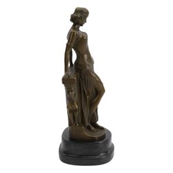 After Milo; Egyptian lady leaning on a wall with sphinx carving, upon a stepped oval base H25cm