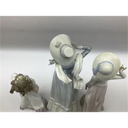 Three Lladro figures, comprising, Dreams of Summer Past no 6401, Spring Breeze no 4936 and Breezy Afternoon 5682 together with Lladro plaque Art Brings us Together no 7677, all in original boxes, largest example H35cm