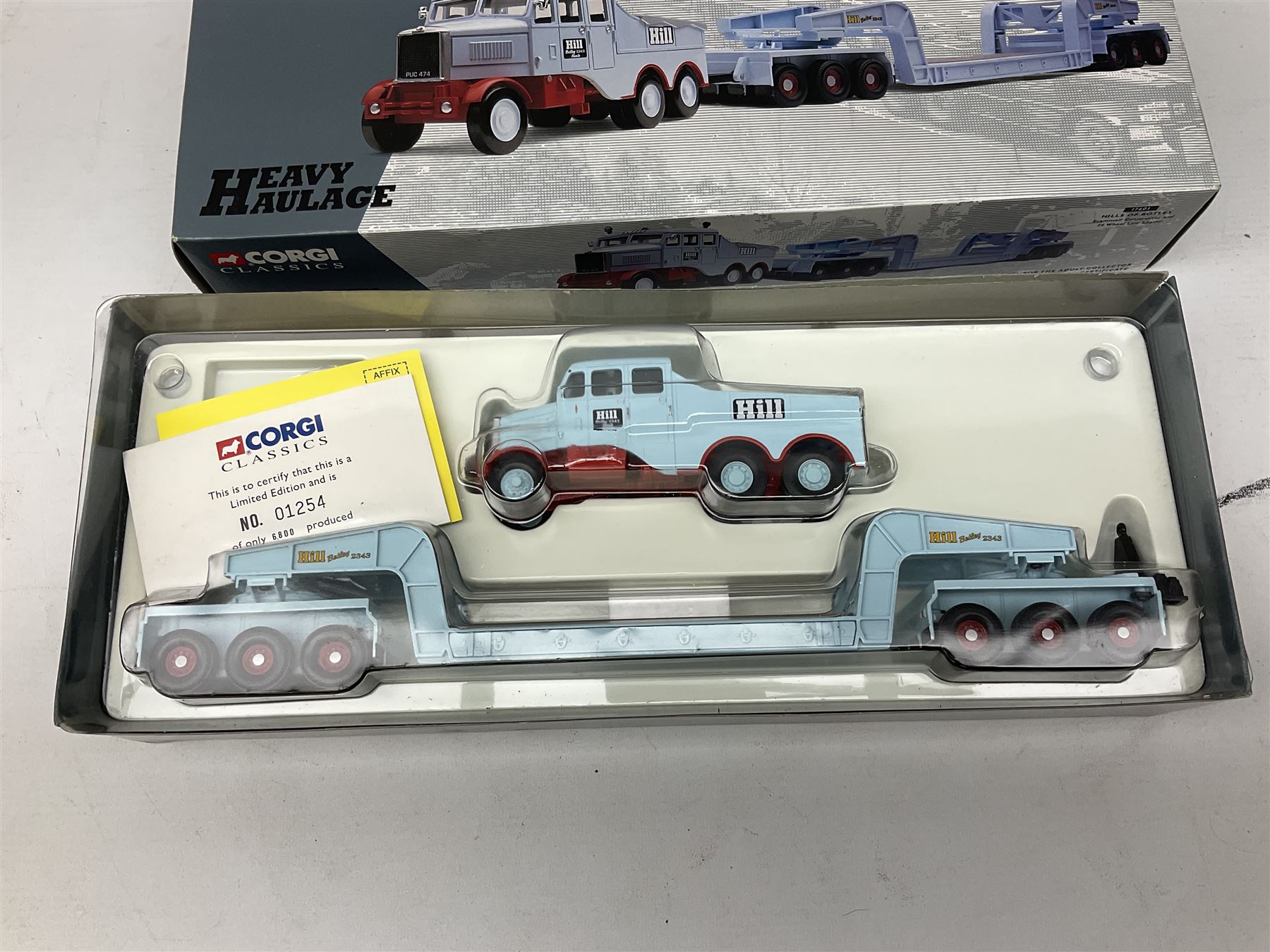 Corgi - Modern Trucks Series No.75401 Leyland Daf Curtainside James Irlam & Sons Ltd in perspex case; Classics Heavy Haulage No.17601 Scammell Constructor and 24 wheel low loader, boxed with certificate 01254/6800; and limited edition Classics No.55201 Pickfords Diamond T Ballast (x2) with 24 wheel Girder Trailer and Steel Casting Load, boxed with certificate 05318/8200. (3)