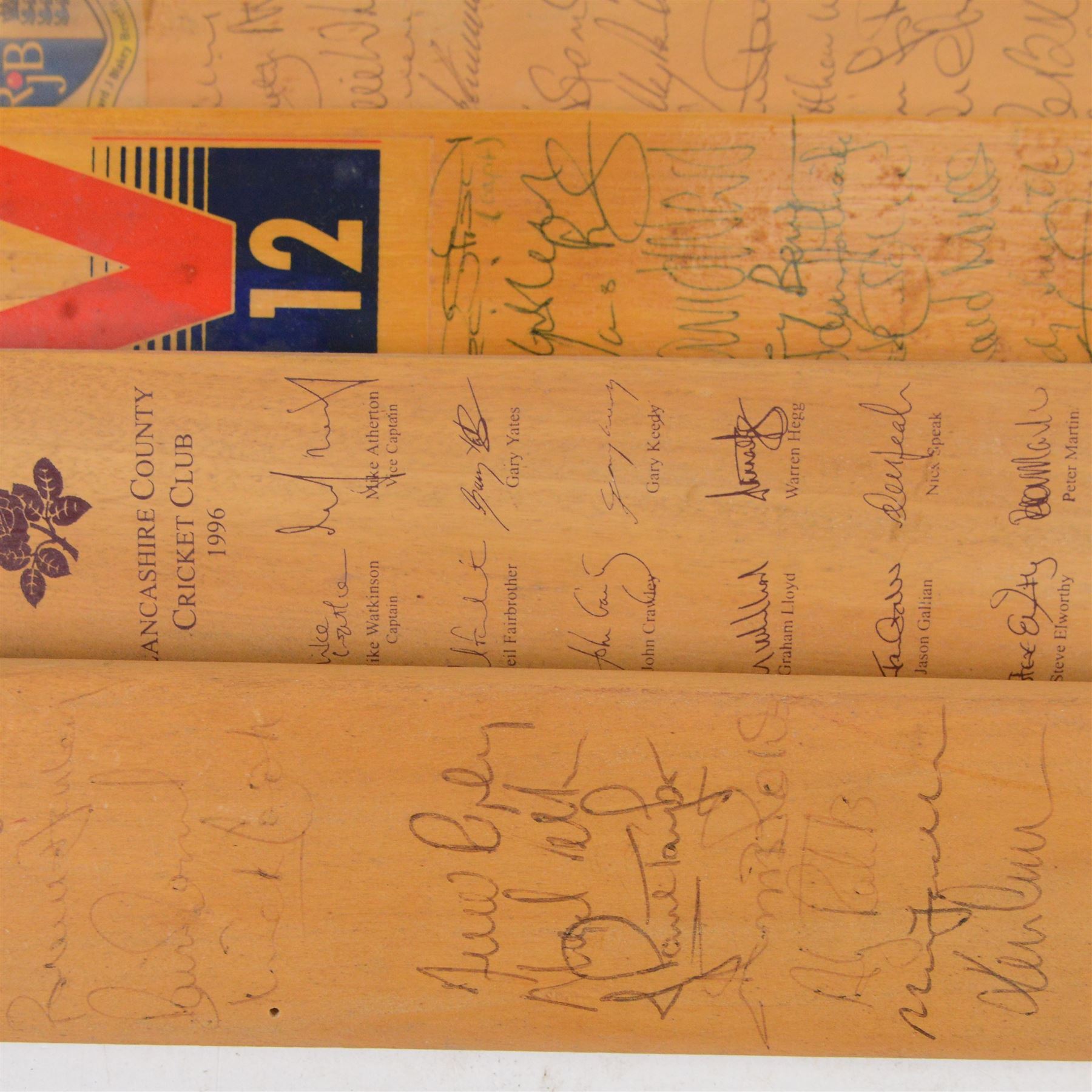 Sixteen signed miniature cricket bats, signed by 1990s County Cricket teams, including Northamptonshire 1992, Lancashire 1996, Surrey 1994, Essex 1991, Richard Blakely Benefit 1998, Worcester 1990 and Glamorgan 1994