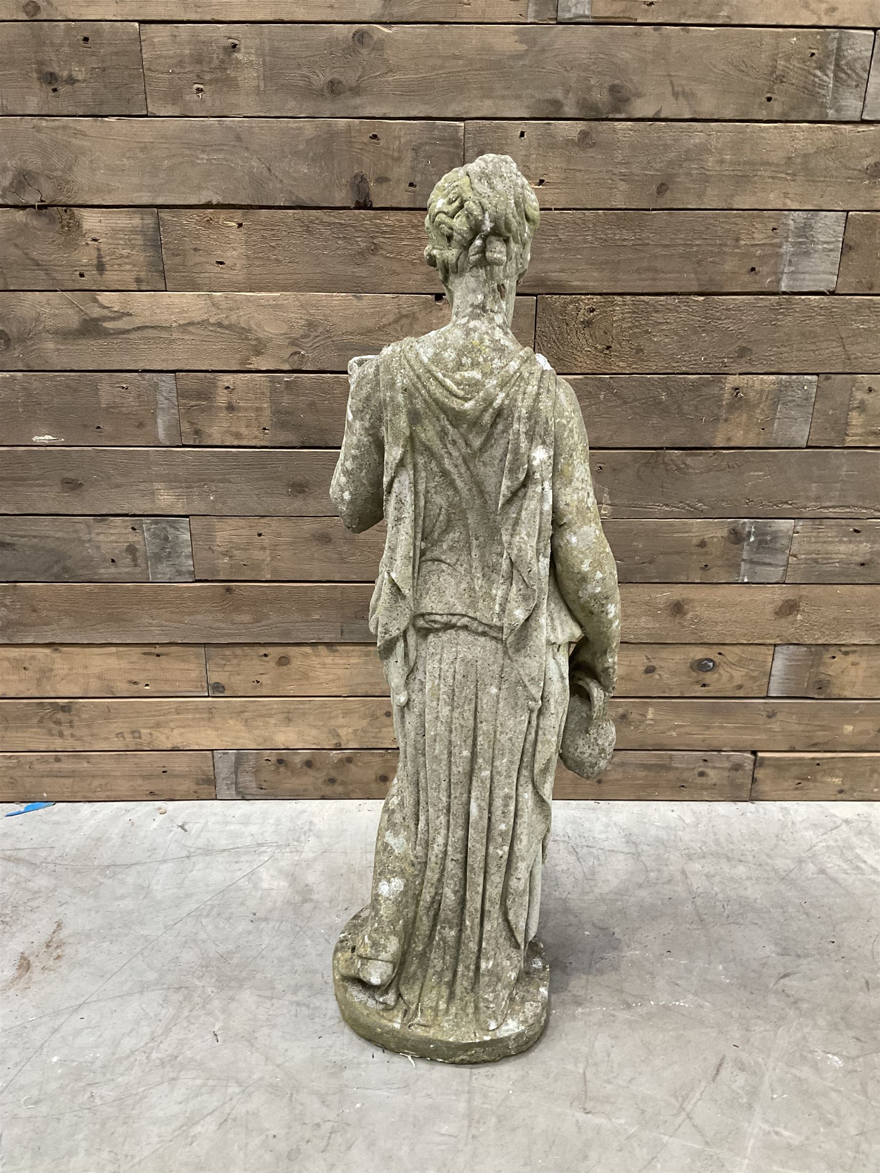 Pair of cast stone garden dogs and 2 female figures,