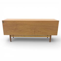 Portwood - Mid 20th century teak sideboard, rectangular top with fall front in the centre flanked by cupboard doors with recessed handles, above four drawers raised on tapered legs