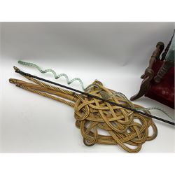 Victorian beadwork footstool with two other wooden upholstered footstools, one with turned bobbin legs, two Victorian glass frigger canes, one of twisted spiral form, and three carpet beaters