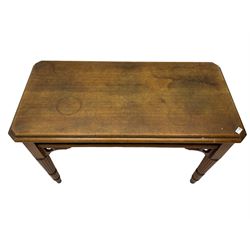 20th century oak ecclesiastical side table, the canted rectangular top with canted corners, pierced arcade frieze, on turned and reeded supports