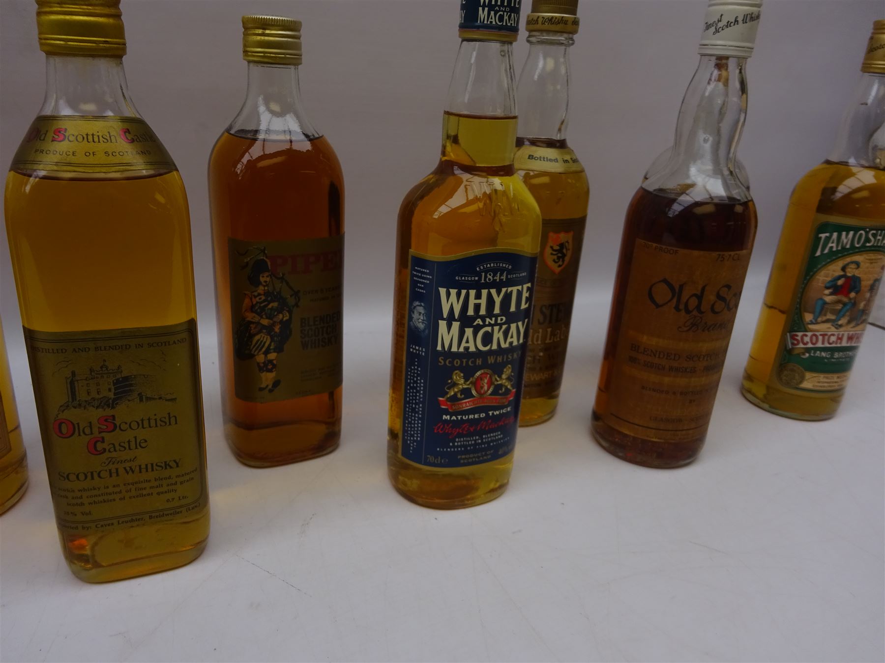 Twelve bottles of blended Scotch whisky, including Finest Reserve Glen Nevis, Morton's, Piper etc, various contents and proofs (12)