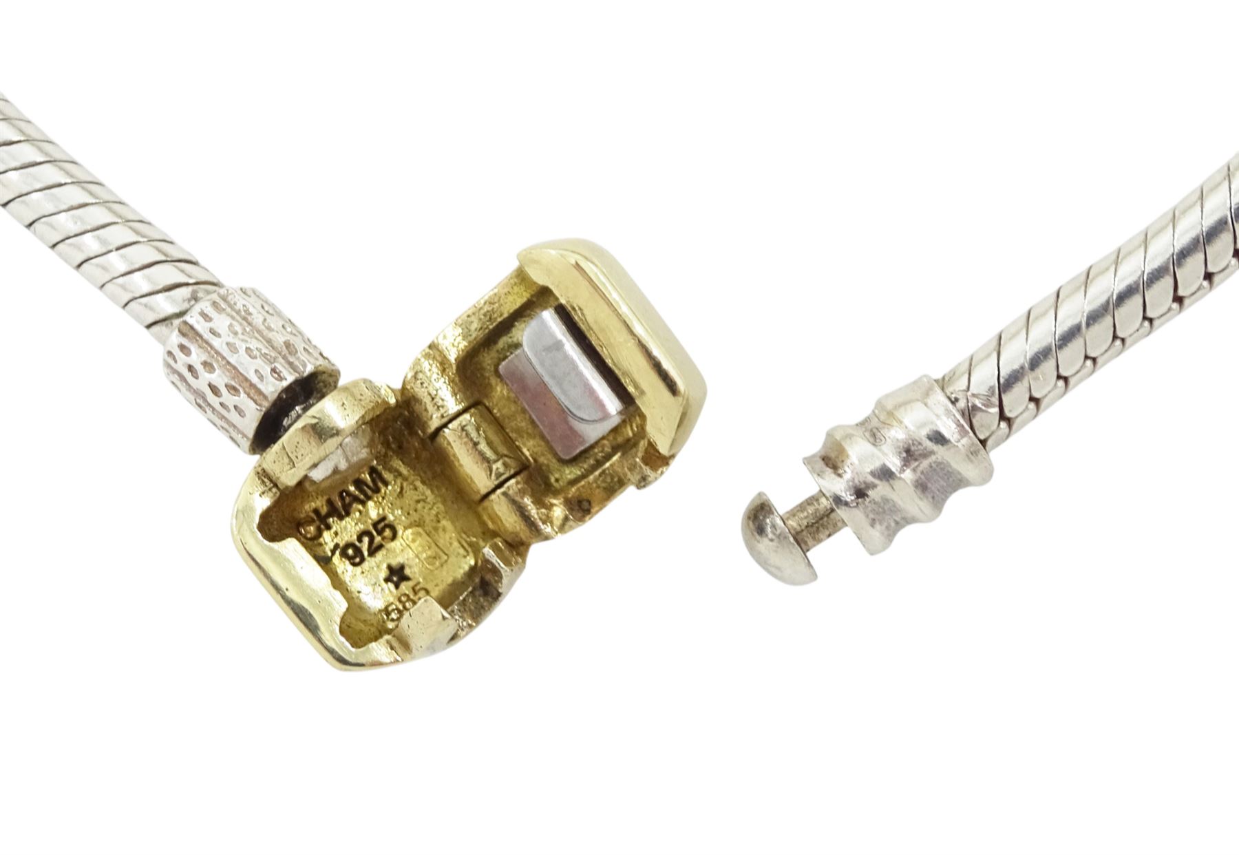 Chamilia 14ct gold and silver charm bracelet, silver bracelet, with 14ct gold and silver finials, six 14ct gold charms including cubic zirconia, four silver charms and two silver and 14ctgold charms, boxed