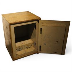 Early 20th century painted iron and steel safe, square form with moulded panel door, applied handle and lock plate with three keys, the interior fitted with twin cash drawers with recessed handles, on low cast feet