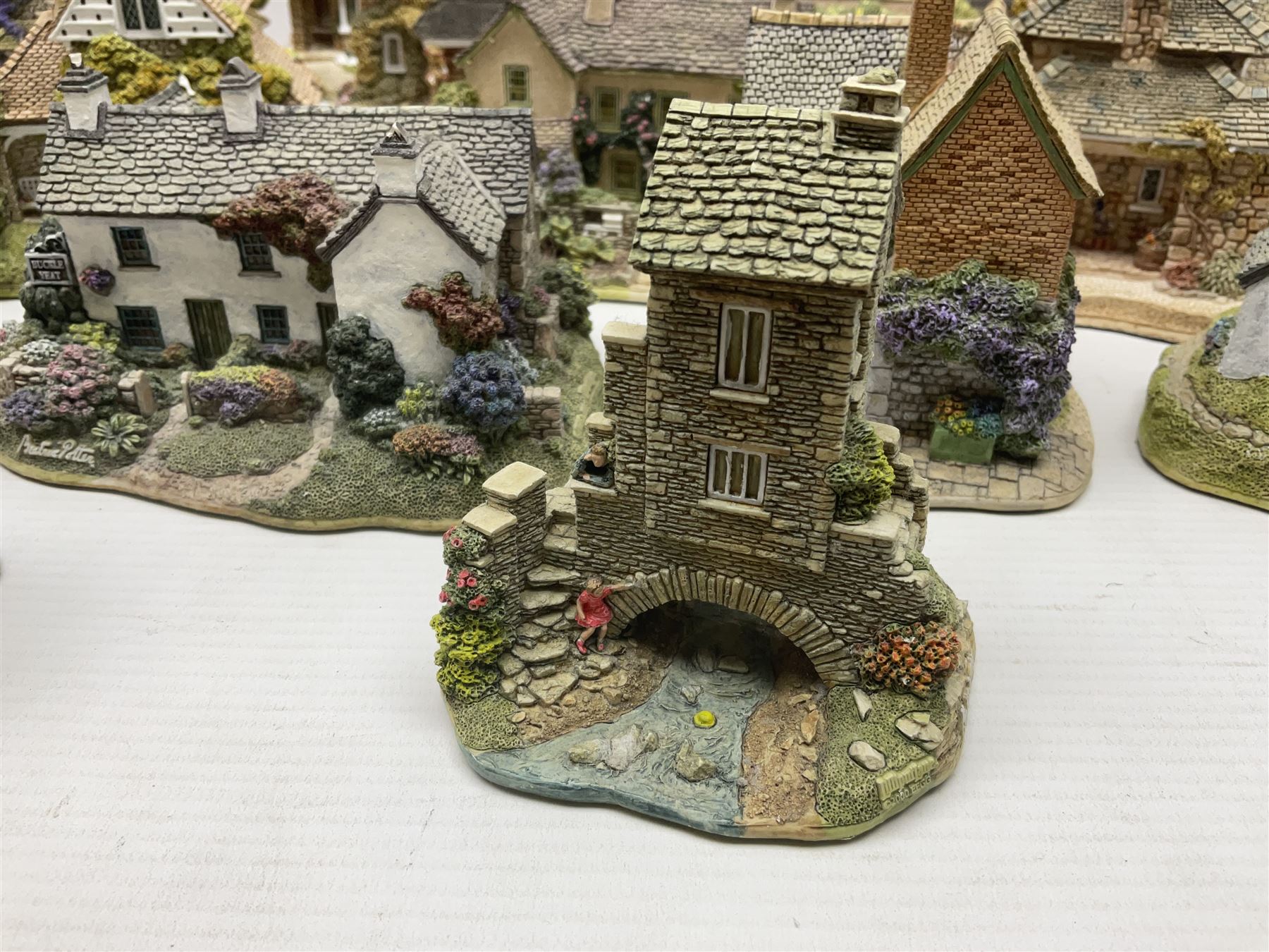 Eight Lilliput Lane limited edition Beatrix Potter models, including Buckle Yeat, Tabitha Twitchits Shop and Ginger Pickles Shop, together with twelve Lilliput Lane models from the Blaise Hamlet collection, including Dial Cottage, Diamond Cottage and Vine Cottage, all with deeds and original boxes (20)