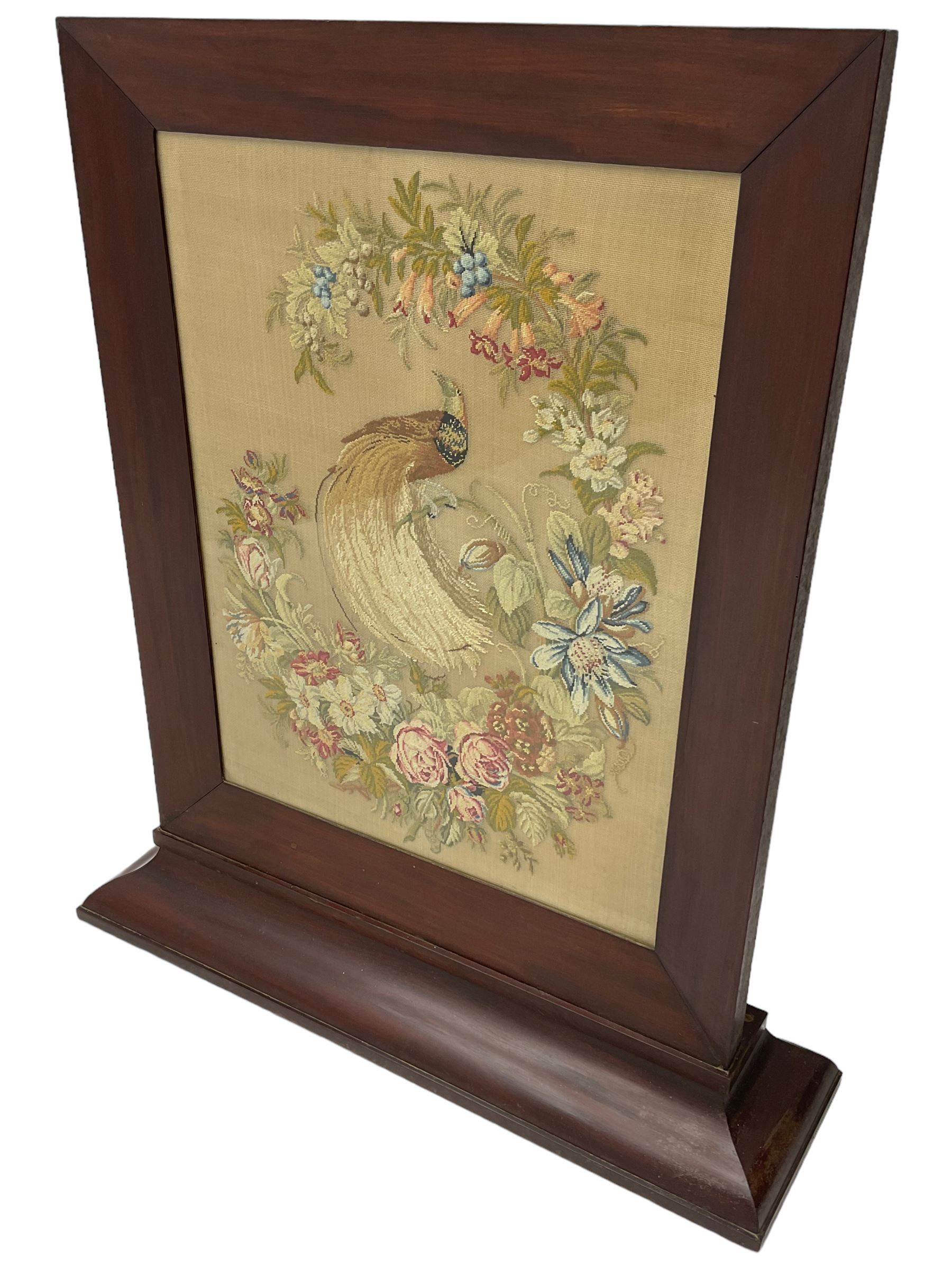 Victorian mahogany fire screen, the tapestry panel depicting peacock and flowers