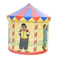 Dennis Chinaworks circus tent jar, designed by Sally Tiffin, the body decorated with clowns, upon a yellow ground, the lid decorated as a circus top, limited edition 12/25, impressed and painted marks beneath 