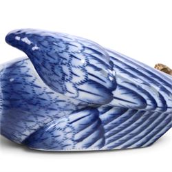 Pair of wall sconces, modelled as blue parrot upon a gilt branch, H47cm