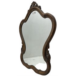 French design stained beech framed wall mirror, shaped and moulded framed with scrolling foliage carved pediment and brackets, plain mirror plate 