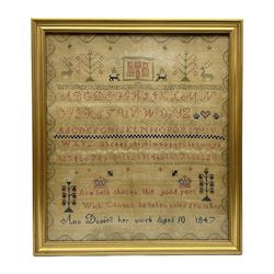 Victorian needlework sampler, worked by Ann Davies age ten, 1847,  with the alphabet and numbers below animal, tree and house, motifs within floral border, framed H49cm, W43cm