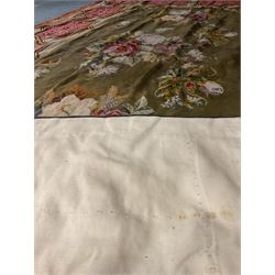 Needlework rug, green ground field decorated with flowers, the border decorated with a series of geometric panels with scroll and anthemion decoration, Greek key outer border 