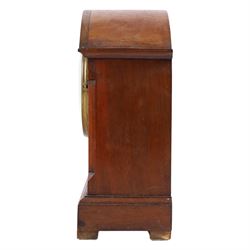 Gilbert Clock Company eight-day mahogany cased mantle clock, with a cream card dial, break arch top, upon a raised plinth, H28cm