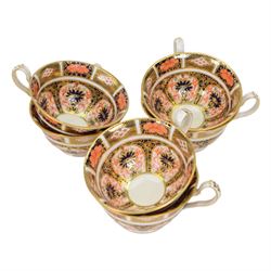 Royal Crown Derby tea service for six in Imari 1128 pattern, comprising teacups and saucers, side plates, sandwich plate, milk jug, open sucrier and cake slice 