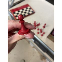 19th century walnut and brass bound games compendium box, painted to enhance the grain, of rectangular form, the hinged opening cover with rounded sides, central brass cartouche with engraved lion crest, and brass riveted straps, opening to reveal a red leather and blue silk lined compartmented interior, with fold-down games board, and lift-out tray containing playing cards, ebony turned dice towers, white and red stained bone draughts, and chess pieces, ivory dice, and ivory and ebony whist markers, and brass bezique board, cribbage board and markers, H15cm W32cm D24cm
This lot has been registered for sale under Section 10 of the APHA Ivory Act
