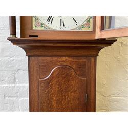 Thirty-hour oak cased longcase clock by  William Bancroft of Scarborough circa 1830, with a swan’s neck pediment, brass patera and three brass spire and ball finials, stepped break arch hood door flanked by plain pillars with brass capitals, trunk with a full length door and curved arch top, on a plain square plinth with bracket feet, painted break arch dial with roman numerals and quarter hour Arabic’s, date recorder (anti clockwise) and matching brass hands, arch painted with a rural scene depicting a ruined tower and cottage with depictions of flowers to the spandrels, dial pinned directly to a chain driven countwheel striking movement, striking the hours on a bell. With weight and pendulum. The Bancroft family were prodigious Scarborough clockmakers during the 18th and 19th century, William Bancroft is recorded as working in Newborough Street from 1820 onwards. 


