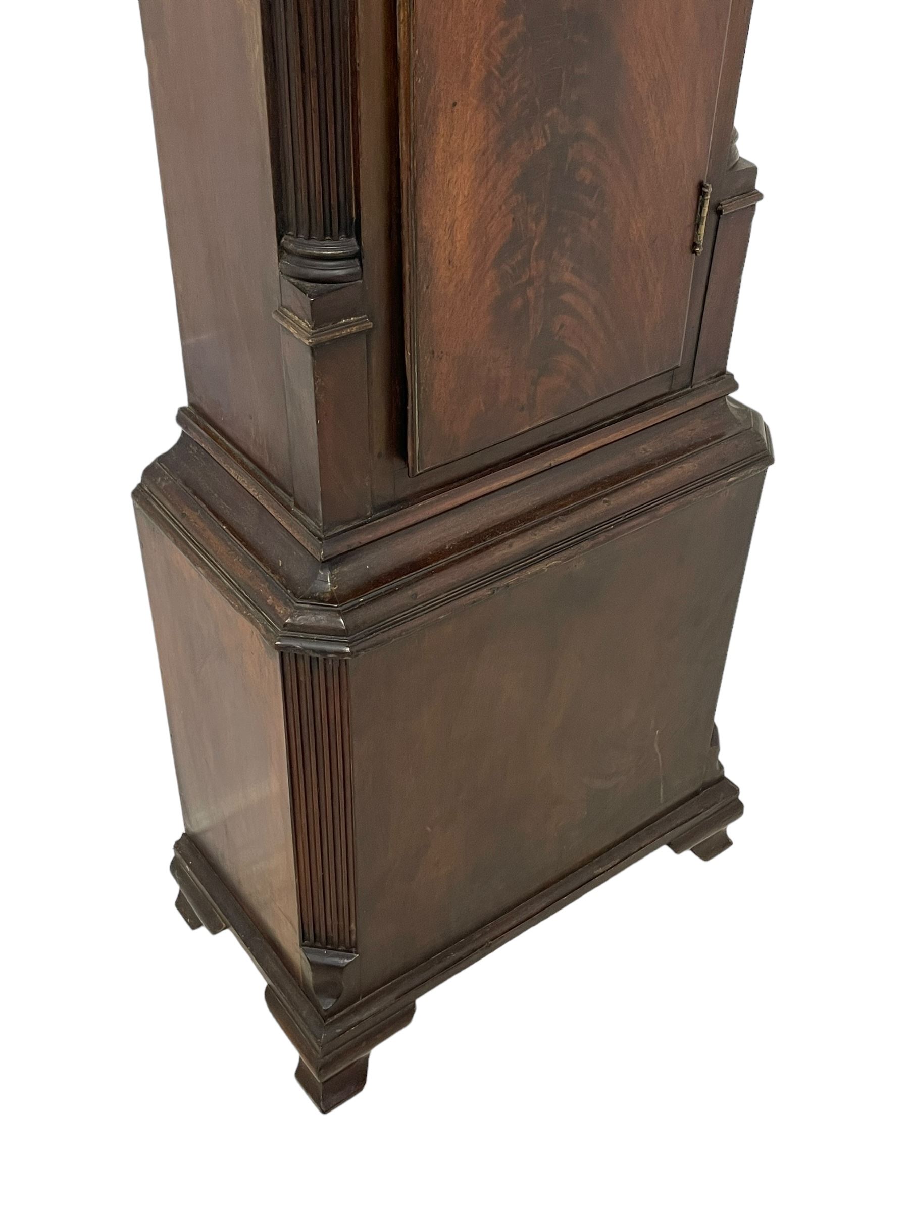 William Vale of Finsbury (London) - late 18th century 8-day mahogany longcase clock, flat topped break-front hood with a break-arch hood door, detached reeded pilasters with wooden capitals, trunk with a blind fret, stopped reeded quarter columns and a long wavy topped door, on a square plinth with canted corners and bracket feet, engraved silver sheet dial with cast brass spandrels, matching steel hands and rolling moon to the arch, with an engraved seconds dial, Roman numerals, five minute Arabics, minute markers and matching steel hands, three train, quarter chiming  movement on six bells with a recoil anchor escapement. With pendulum and weights.

This item has been registered for sale under Section 10 of the APHA Ivory Act