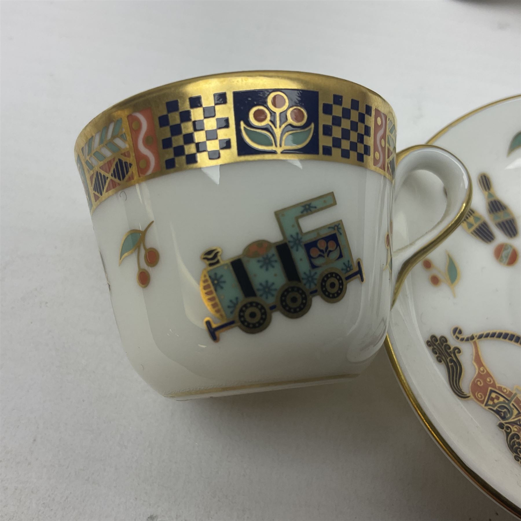 Royal Crown Derby Treasures of Childhood cabaret set, comprising tray, milk jug, sucrier, teacup and saucer, together with two Royal Crown Derby Treasures of Childhood paperweights Fleur and Ragdoll Sailor and Teddy bear paperweight, all paperweights are without stoppers