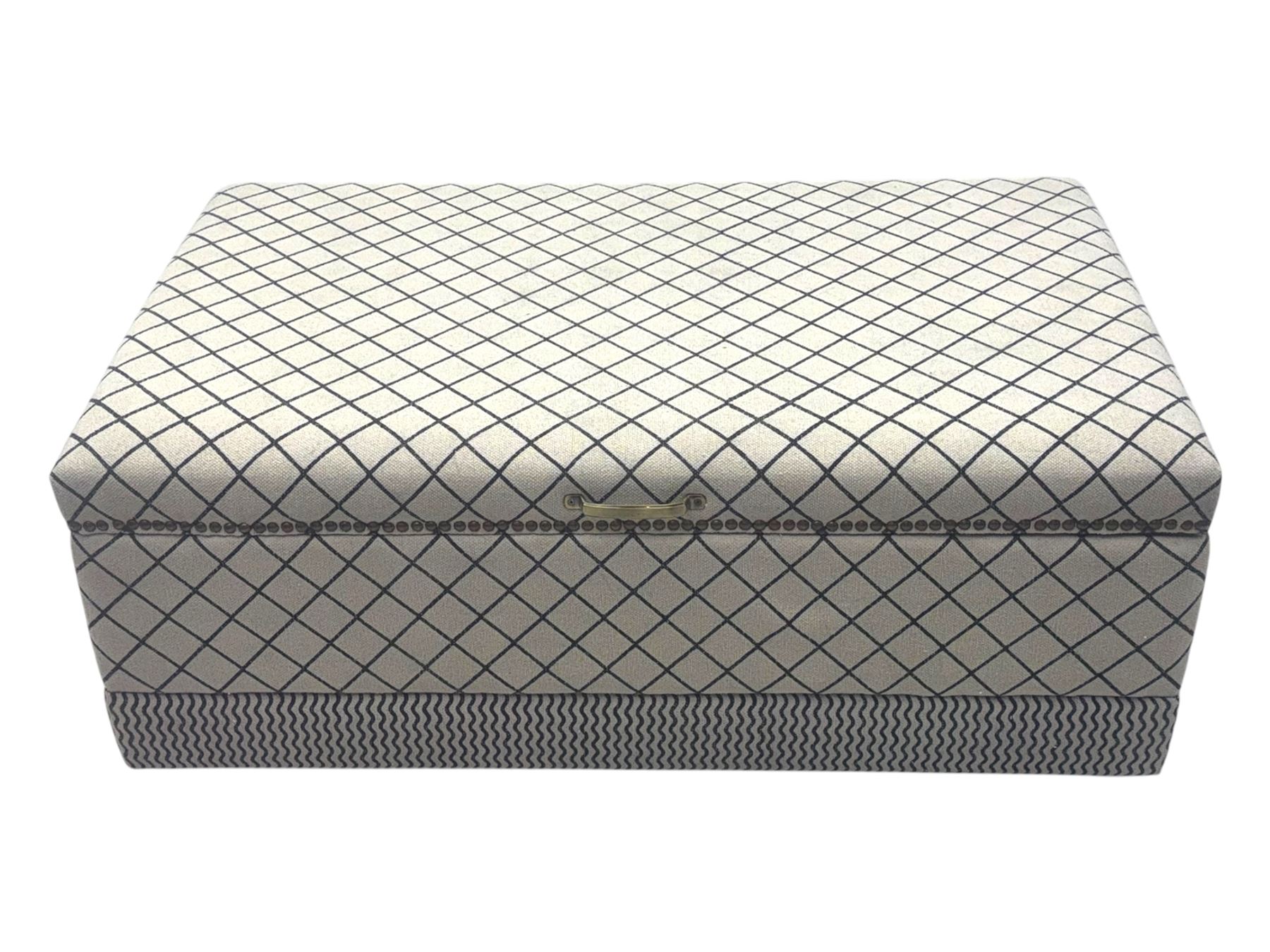 Oka - contemporary mango wood upholstered ottoman, rectangular frame with a printed cotton dhurrie featuring a diamond pattern and wavy stripe border, fitted with brass hinges, decorative studs, and handle