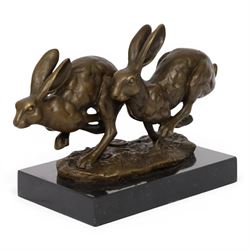 Bronze figure group, modelled two hares in chase, upon naturalistically modelled oval base...
