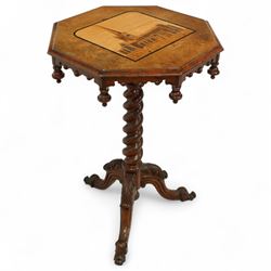 Victorian inlaid walnut occasional table, the octagonal top inlaid with a marquetry scene of Shakespeare's Church - The Holy Trinity at Stratford-Upon-Avon, over an ecclesiastical design frieze with turned finials and castellated form, raised on a spiral turned pedestal terminating to an acanthus carved tripod base with scroll feet, circa 1860