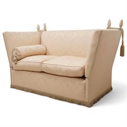 Knole design hardwood-framed drop-arm two-seat sofa, upholstered in cream Damask fabric decorated with repeating foliate pattern, with twist fringe, 