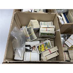 Quantity of cigarette and trade cards, housed in albums and loose, by W.D. & H.O. Wills, John Player & Sons etc, including cycling, garden hints, Britain's railways, dogs etc and various empty vintage cigarette card albums, in two boxes