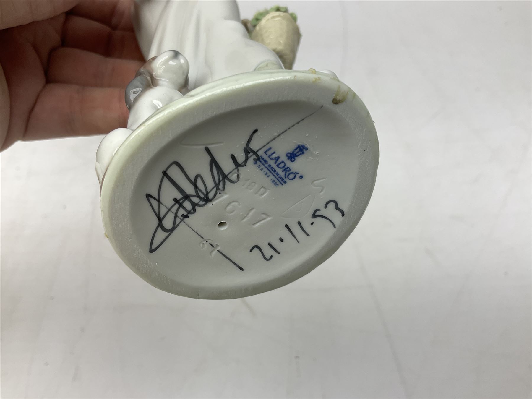 Two Lladro figures, comprising Garden Classic, no 7617 and Garden Song, no 7618, with original boxes and artists signature beneath, largest example H23cm