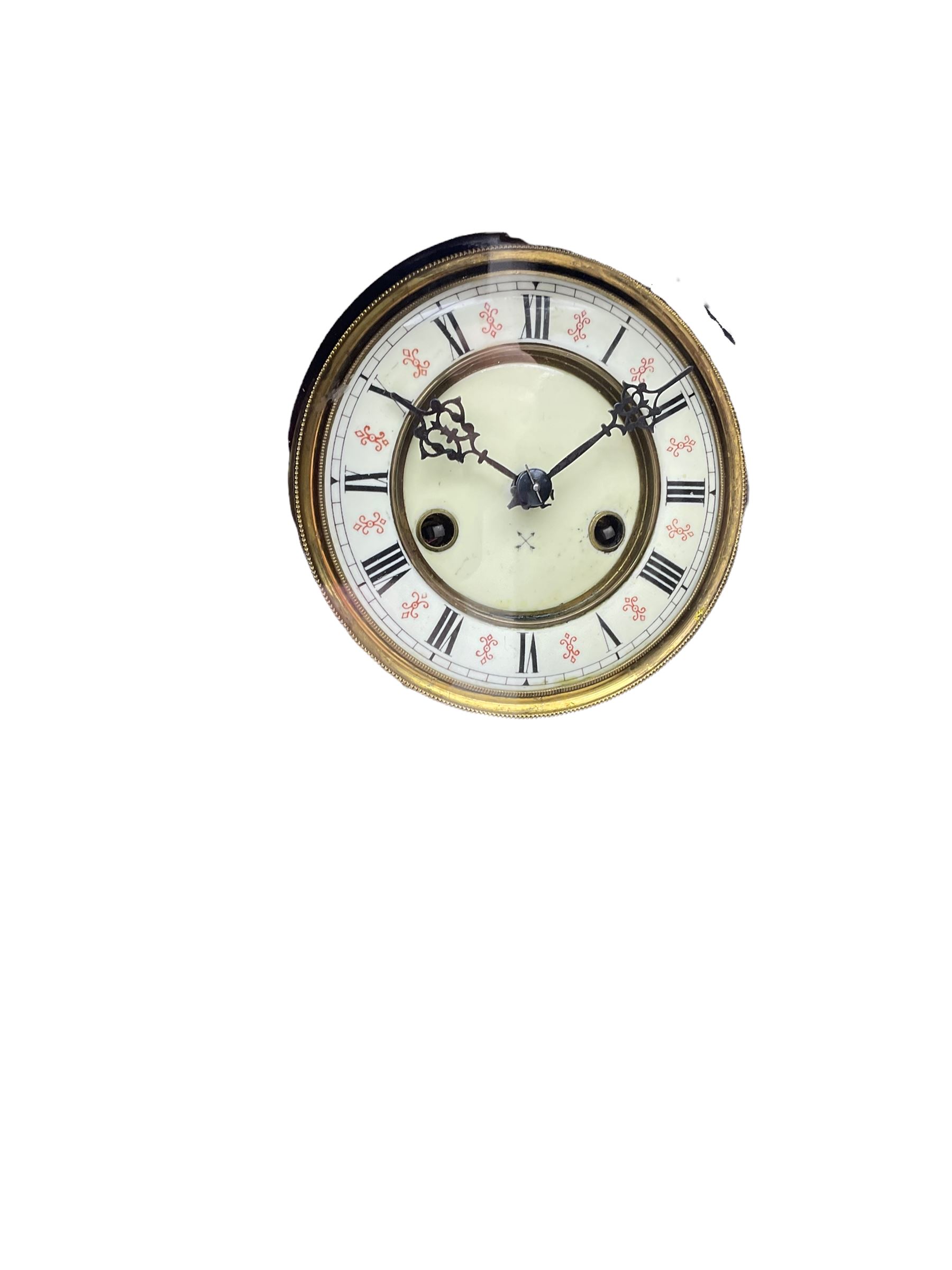 Small Spring driven German wall clock in a mahogany case with turned