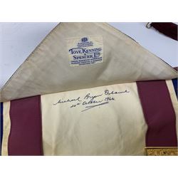 Two Masonic kid leather aprons, one with sash and cuffs, the other with sash, each marked 'Yorkshire North and East Ridings'; and three other unmarked Masonic aprons with sashes