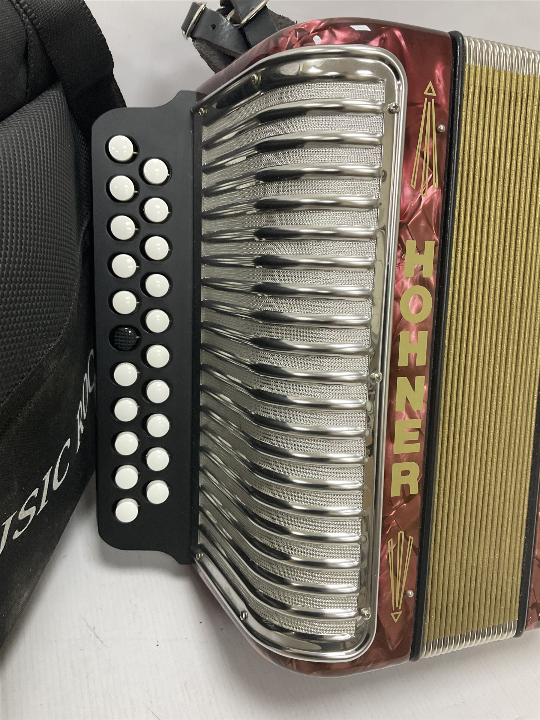 Hohner Double Ray black dot button melodeon in B/C; modern Irish style with eight bass and twenty-one treble buttons and double strap, with soft carrying case