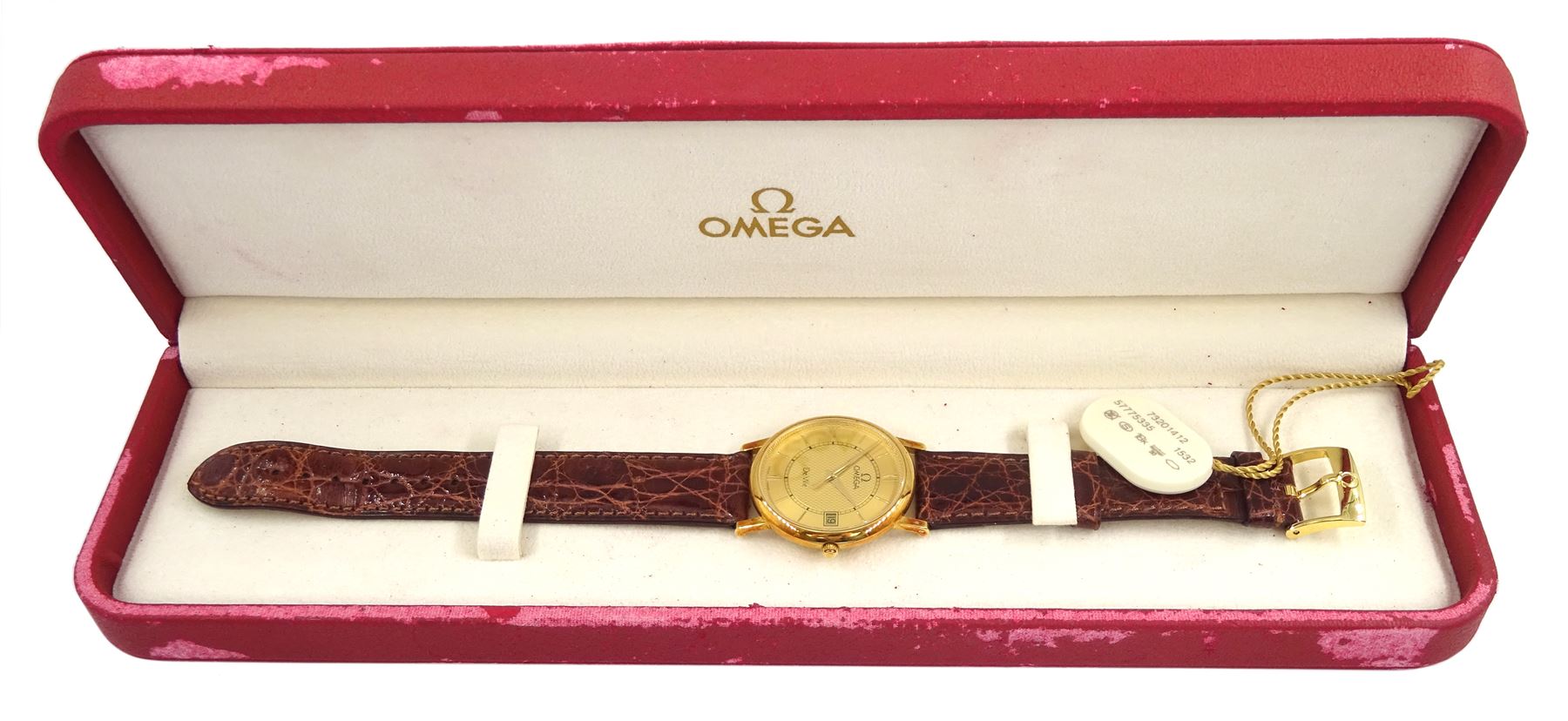 Omega De Ville gentleman's 18ct gold quartz presentation wristwatch, Ref. 73201412, champagne dial with date aperture, on original brown leather strap with gilt buckle, box with warranty card dated 2004