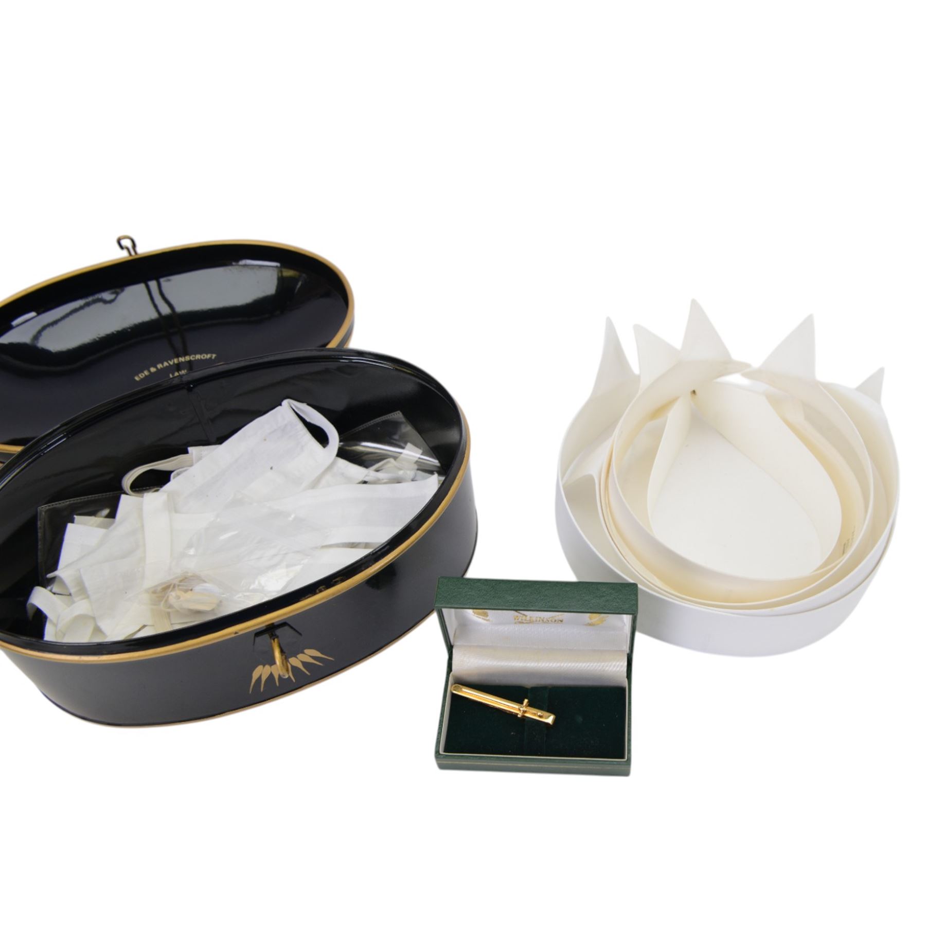 Judge's regalia, including, barrister’s wig in tin monogrammed J.A.W, Ede and Ravenscroft gown, tin of collars, jacket and waistcoat by Daniel Drescott, a glass case containing three miniature legal wigs; barrister’s wig, judge’s full bottom wig and bench wig and four Vanity Fair Spy prints