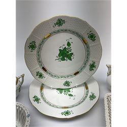 A group of Herend hand painted porcelain, comprising pair of plates with basket weave effect rims, D22.5cm, two small dishes with open work sides, a small jug and cover with flower finial, all decorated with green floral sprays, plus a small twin handled pot and cover or sucrier.