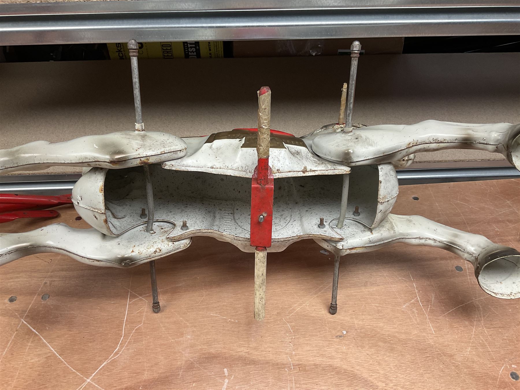 1960's Mobo Toys (David Sebel & Co) Prairie King spring rocking horse on stand, painted pressed steel construction, red tubular stand, trademark red and yellow circular Mobo logo, 100cm long (dismantled)