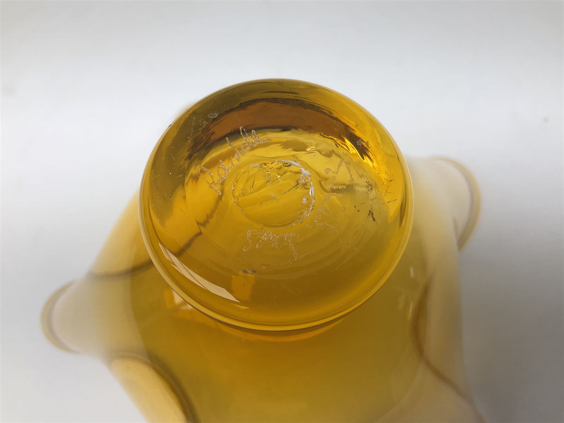 Gillies Jones orange glass bowl with crimped white rim upon a pedestal foot, H11.5cm